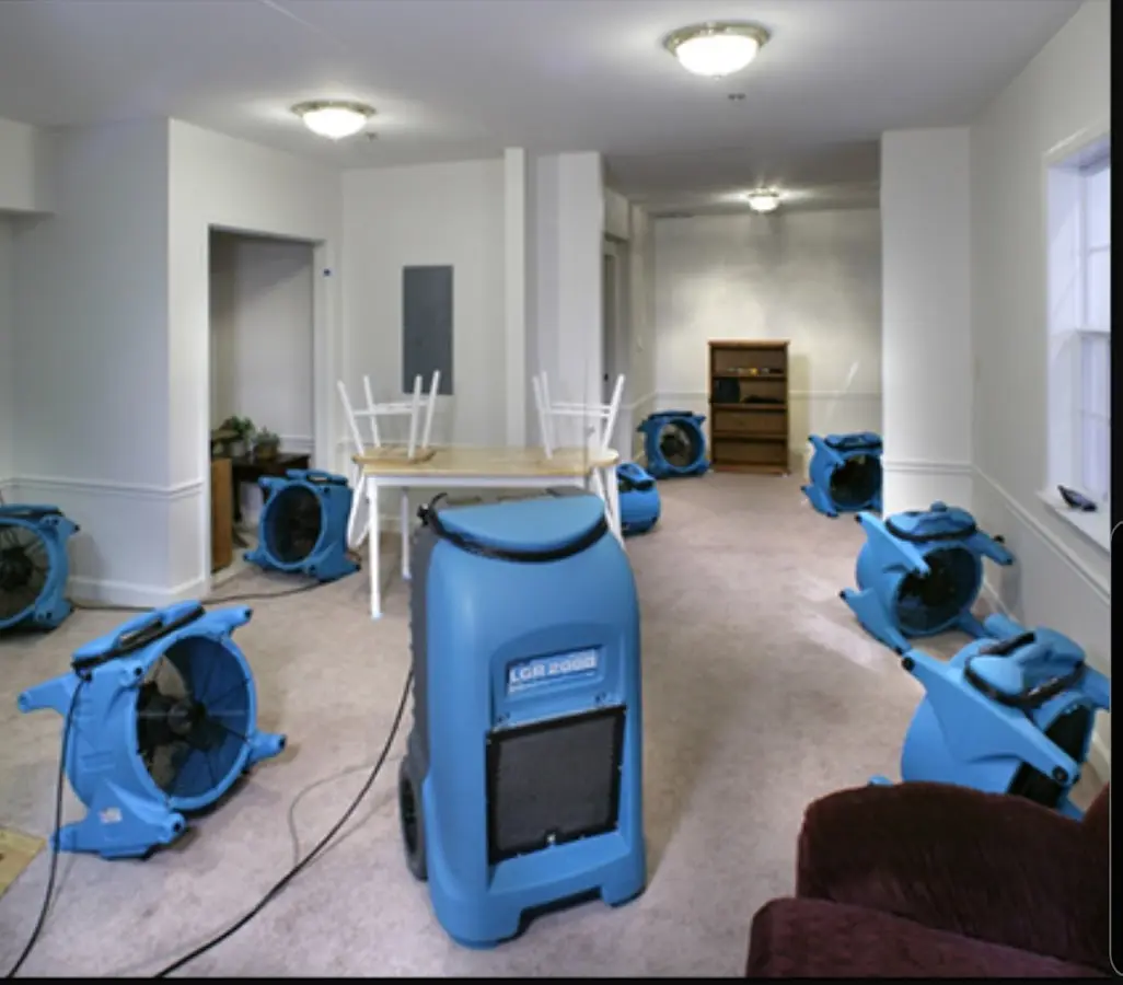 Air movers and dehumidifier setup for Water Damage Restoration in Huntley